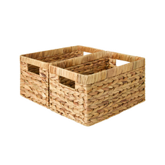 A set of 2 woven water hyacinth storage baskets on a white background