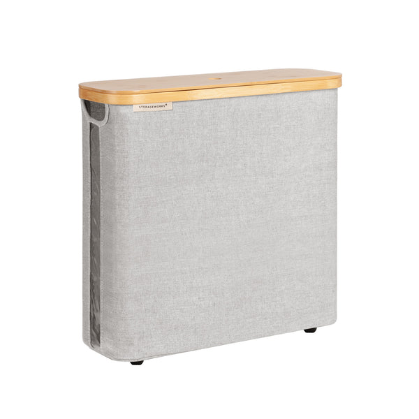 Rectangular gray toilet paper holder with bamboo wood top on a white background