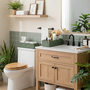 Handwoven Sage Green Paper Rope Toilet Paper Baskets on bathroom shelf, complementing modern decor.