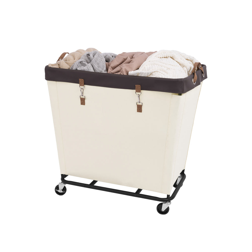 Large rolling laundry basket with wheels, beige fabric, black metal frame, filled with clothes.