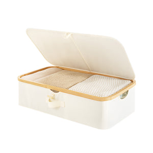 Underbed storage box with bamboo frame, beige fabric, flip-top lid, and fabric handles, fully filled.