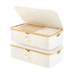 Underbed storage box with bamboo frame, beige fabric, open lid, showcasing storage capacity for clothes and bedding.