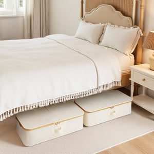Underbed storage box with bamboo frame, neutral color, fabric handles, under a bed with white bedding.
