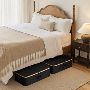 Underbed storage box with bamboo frame, black fabric, shown under a bed in a cozy bedroom setting.